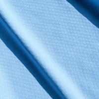 Close-up of blue fabric with a subtle pattern