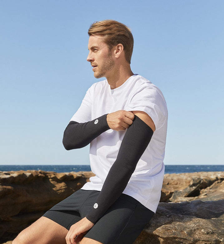 Man sitting on a rock wearing UPF 50+ Solbari clothing