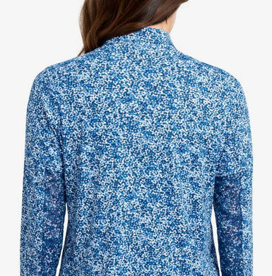 Blue floral patterned shirt worn by a person on a white background
