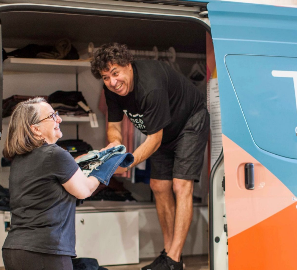 Man selling clothes out of van